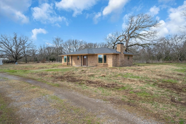 110 Vz County Road 1128, Fruitvale, TX 75127 - view of front of house featuring a chimney, brick siding, and driveway