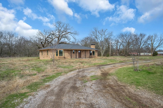 110 Vz County Road 1128, Fruitvale, TX 75127 - view of front of property featuring curved driveway, a chimney, and brick siding