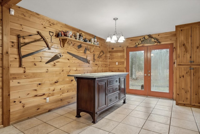 764 Vz County Road 1923, Fruitvale, TX 75127 - kitchen featuring french doors, light tile patterned floors, wooden walls, a chandelier, and pendant lighting