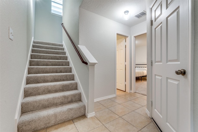 7416 Coronado Ave Unit 14, Dallas, TX 75214 - stairway with tile patterned flooring and baseboards