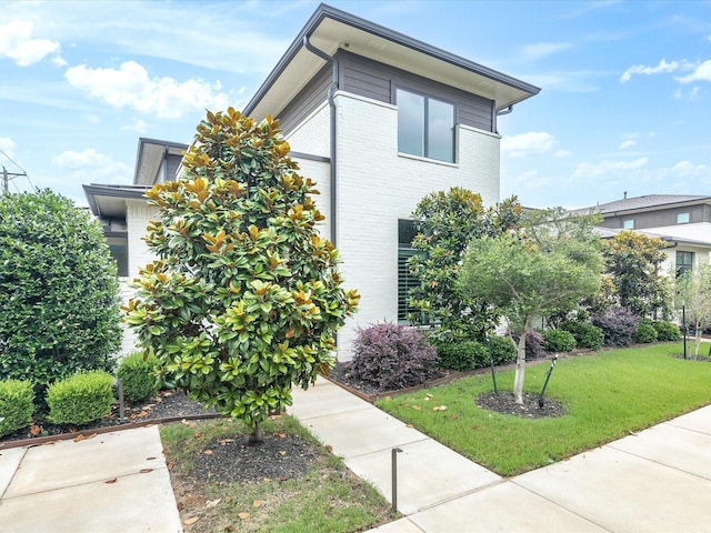 324 Nursery Ln, Fort Worth, TX 76114 - view of property exterior featuring a yard and brick siding