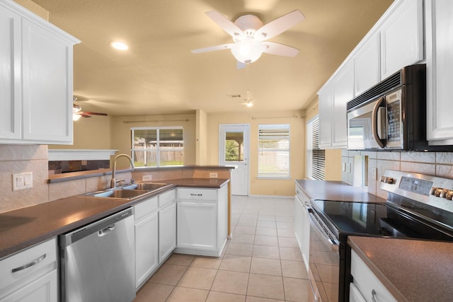 108 Bear Trl, Waxahachie, TX 75165 - kitchen featuring appliances with stainless steel finishes, a ceiling fan, dark countertops, tasteful backsplash, and recessed lighting