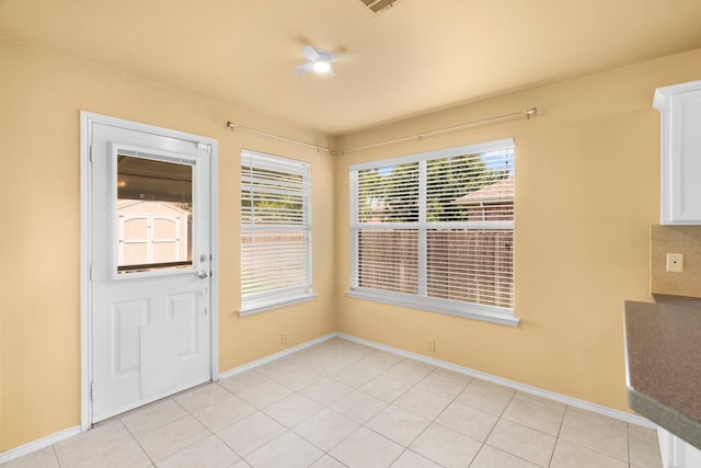 108 Bear Trl, Waxahachie, TX 75165 - unfurnished dining area with healthy amount of natural light, a ceiling fan, and light tile patterned flooring