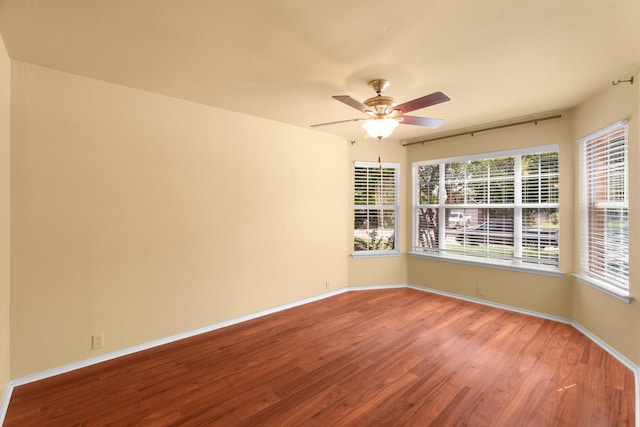 108 Bear Trl, Waxahachie, TX 75165 - empty room with wood finished floors, a ceiling fan, and plenty of natural light