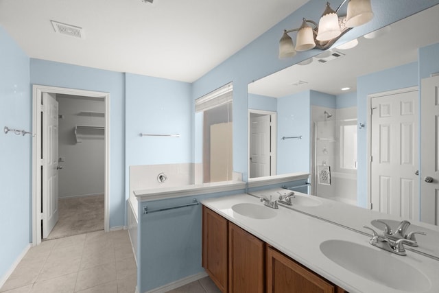 108 Bear Trl, Waxahachie, TX 75165 - full bath with a bath, a shower, double vanity, tile patterned flooring, and a walk in closet