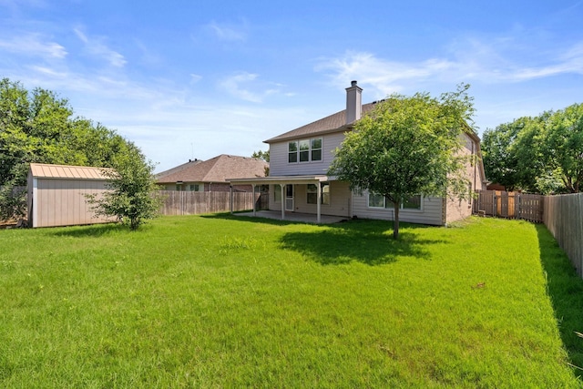 108 Bear Trl, Waxahachie, TX 75165 - back of house featuring a fenced backyard, a patio, and a chimney