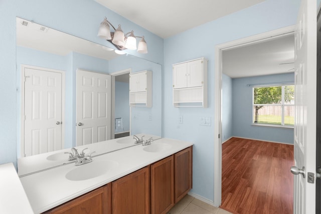 108 Bear Trl, Waxahachie, TX 75165 - bathroom featuring double vanity and wood finished floors