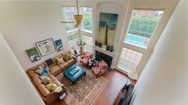 2741 Barrington Dr, Plano, TX 75093 - living room with a towering ceiling, plenty of natural light, a fireplace, and wood finished floors