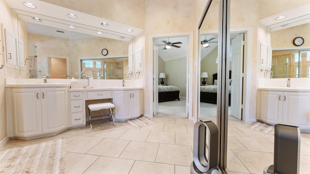2741 Barrington Dr, Plano, TX 75093 - ensuite bathroom with a ceiling fan, two vanities, tile patterned floors, recessed lighting, and a high ceiling