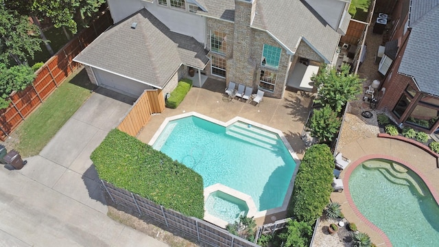 2741 Barrington Dr, Plano, TX 75093 - view of swimming pool with a pool with connected hot tub, a fenced backyard, and a patio area
