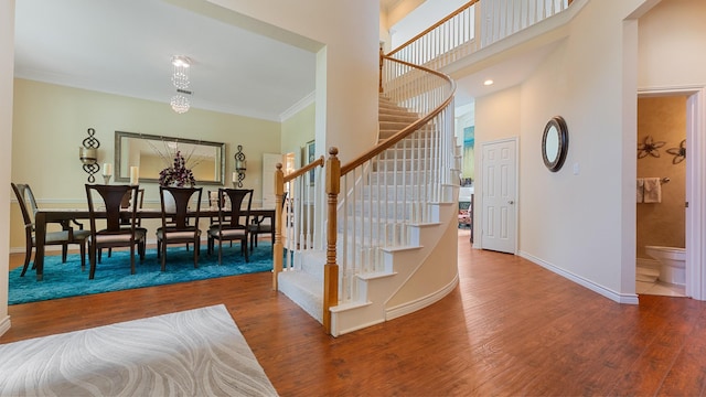2741 Barrington Dr, Plano, TX 75093 - entrance foyer with stairs, wood finished floors, crown molding, and a towering ceiling