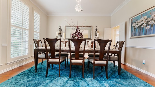 2741 Barrington Dr, Plano, TX 75093 - dining room with healthy amount of natural light, crown molding, wood finished floors, and a chandelier