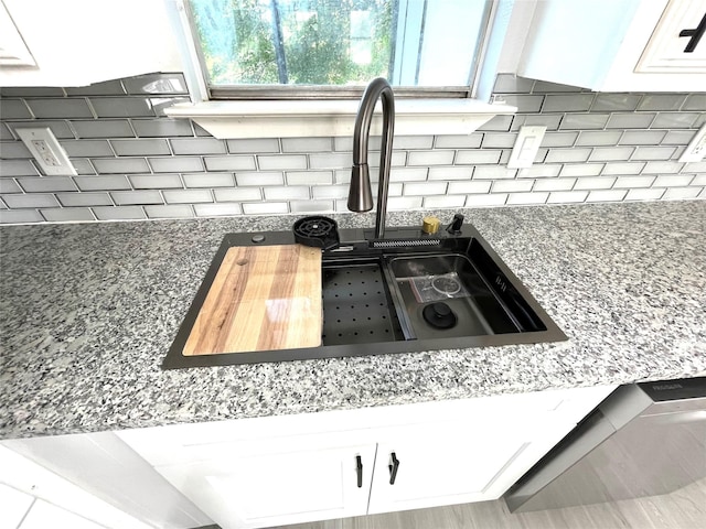 5146 Fm 879, Palmer, TX 75152 - kitchen view of white cabinets, backsplash, and stone counters