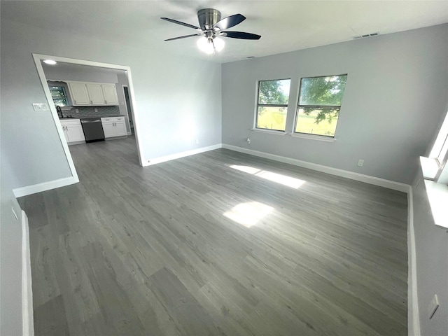 5146 Fm 879, Palmer, TX 75152 - unfurnished living room featuring ceiling fan and dark wood-style floors