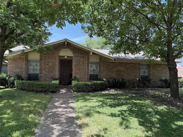 1413 Park E Dr, Garland, TX 75043 - ranch-style house featuring brick siding and a front yard