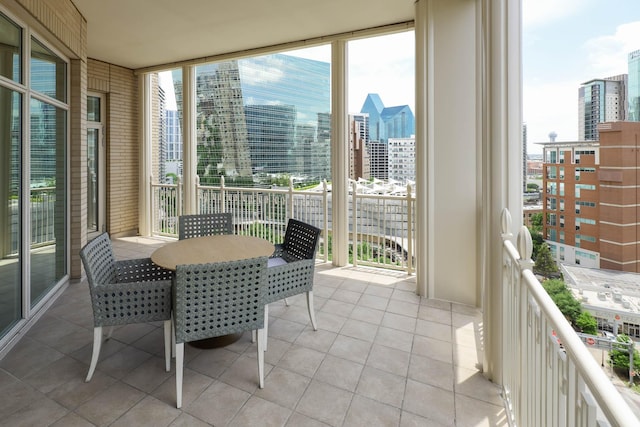 2555 N Pearl St Unit 1101, Dallas, TX 75201 - balcony with a city view and outdoor dining space