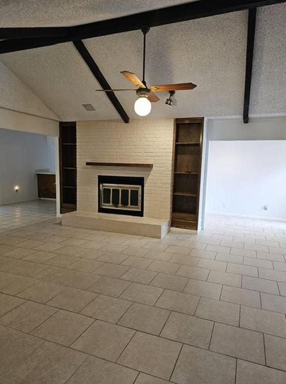 1601 Meadow Ln, Terrace, Fort Worth, TX 76112 - unfurnished living room with a brick fireplace, built in features, a ceiling fan, and a textured ceiling