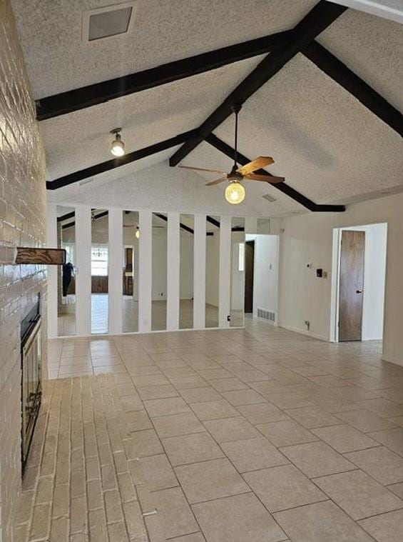 1601 Meadow Ln, Terrace, Fort Worth, TX 76112 - unfurnished living room featuring a textured ceiling, a fireplace, light tile patterned floors, and ceiling fan