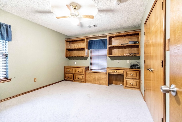 1237 Linkwood Ln, Lancaster, TX 75146 - unfurnished office with light carpet, plenty of natural light, a textured ceiling, and ceiling fan