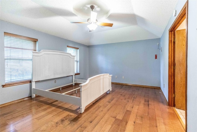 1237 Linkwood Ln, Lancaster, TX 75146 - bedroom featuring light wood-type flooring, a ceiling fan, and a textured ceiling