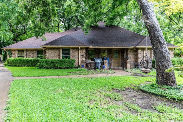 1237 Linkwood Ln, Lancaster, TX 75146 - view of front facade with a front yard, roof with shingles, and brick siding