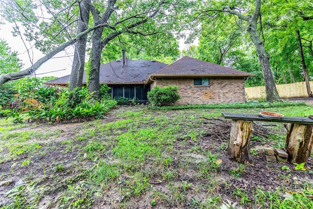 1237 Linkwood Ln, Lancaster, TX 75146 - rear view of property with brick siding and a shingled roof
