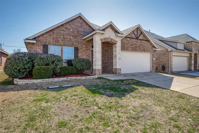 5104 Pebble Beach Trl, Denton, TX 76208 - view of front of house featuring brick siding, an attached garage, a front lawn, and concrete driveway