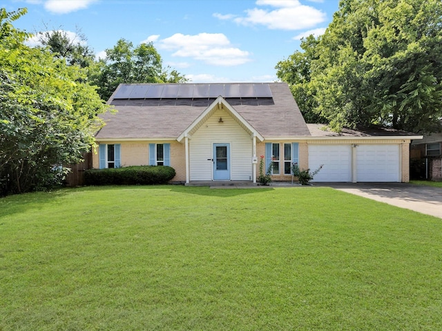 6708 Wagonet Rd, Forest Hill, TX 76140 - view of front of house featuring concrete driveway, solar panels, a garage, a front yard, and brick siding