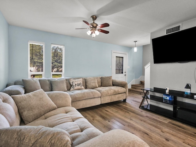 6708 Wagonet Rd, Forest Hill, TX 76140 - living area with wood finished floors, ceiling fan, and stairs