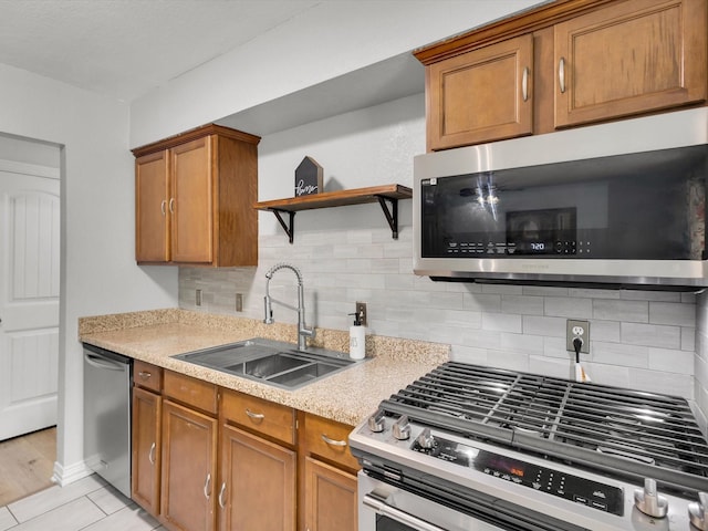 6708 Wagonet Rd, Forest Hill, TX 76140 - kitchen with stainless steel appliances, light countertops, brown cabinetry, open shelves, and decorative backsplash