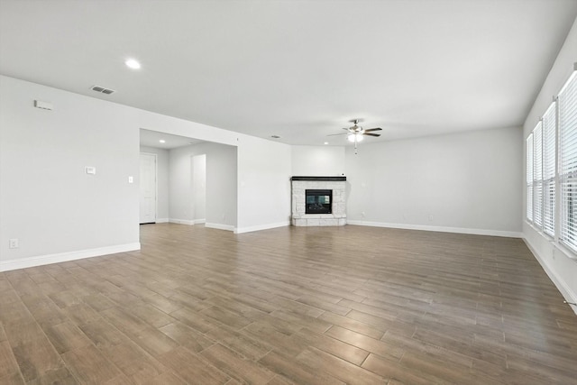 260 Clairmont Dr, Ponder, TX 76259 - unfurnished living room featuring ceiling fan, wood finished floors, recessed lighting, and a fireplace
