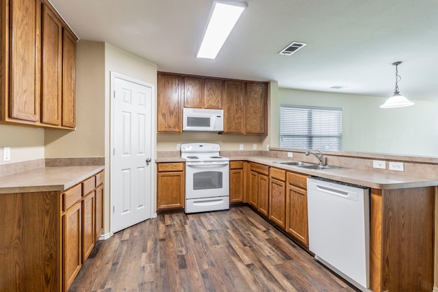 13264 Harvest Ridge Rd, Fort Worth, TX 76244 - kitchen with white appliances, a peninsula, dark wood finished floors, and brown cabinets