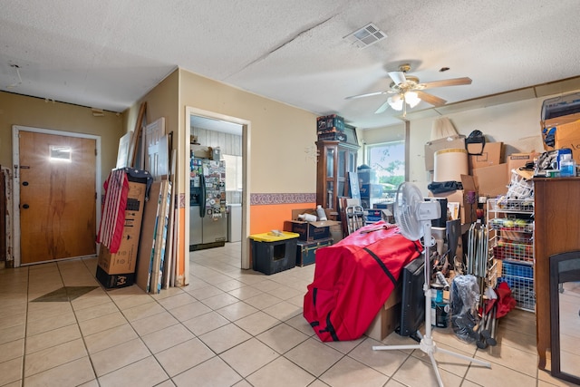 2200 SE 26th Ave, Mineral Wells, TX 76067 - dining room with a ceiling fan, a textured ceiling, and tile patterned flooring