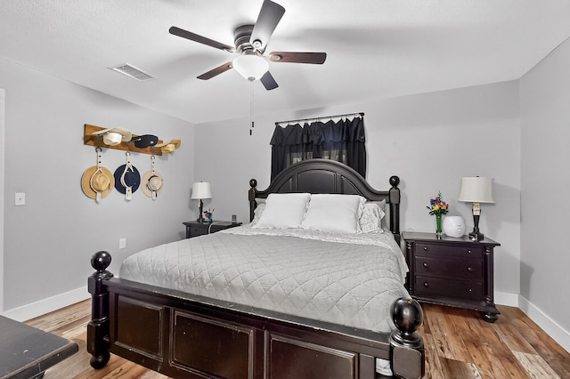 1008 County Road 4759, Sulphur Springs, TX 75482 - bedroom with light wood finished floors and ceiling fan
