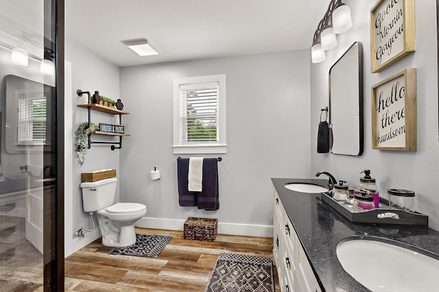 1008 County Road 4759, Sulphur Springs, TX 75482 - bathroom featuring double vanity, wood finished floors, and a stall shower