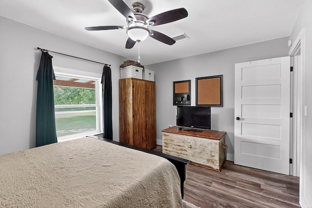1008 County Road 4759, Sulphur Springs, TX 75482 - bedroom with wood finished floors and ceiling fan