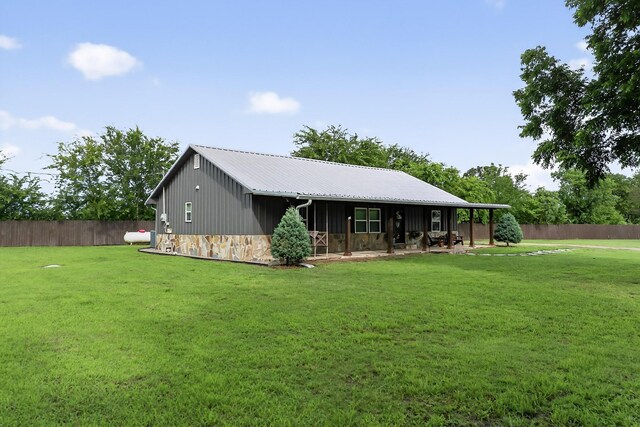 1008 County Road 4759, Sulphur Springs, TX 75482 - rear view of property with stone siding and a metal roof