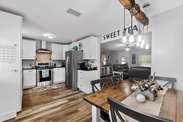 1008 County Road 4759, Sulphur Springs, TX 75482 - dining room with dark wood-style flooring and ceiling fan