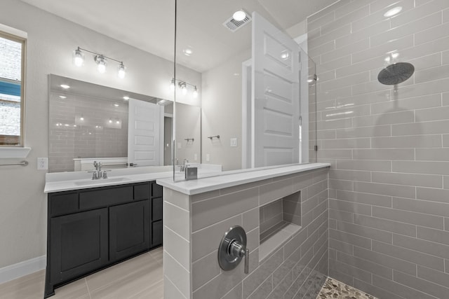 6217 Escarpment Dr, Fort Worth, TX 76112 - bathroom featuring tiled shower and vanity