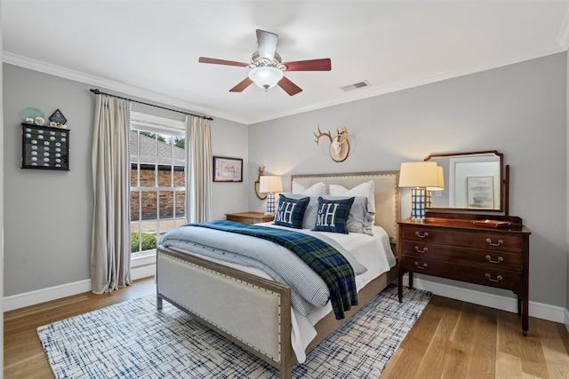 7116 Serrano Dr, Benbrook, TX 76126 - bedroom featuring light wood-type flooring, crown molding, and a ceiling fan
