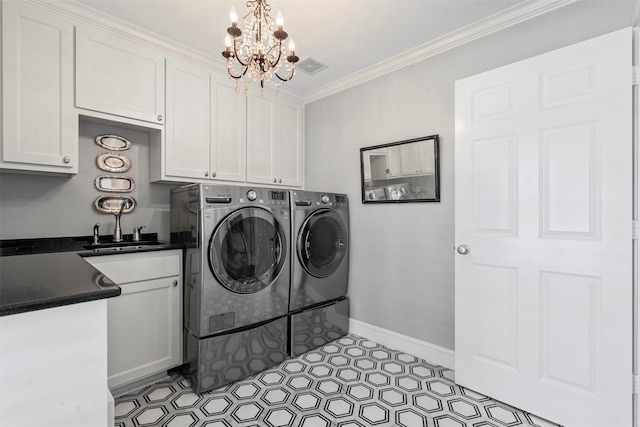 7116 Serrano Dr, Benbrook, TX 76126 - laundry room featuring cabinet space, a chandelier, independent washer and dryer, and ornamental molding