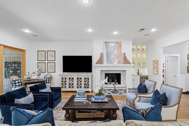 7116 Serrano Dr, Benbrook, TX 76126 - living area with ornamental molding, recessed lighting, a fireplace, wine cooler, and wood finished floors