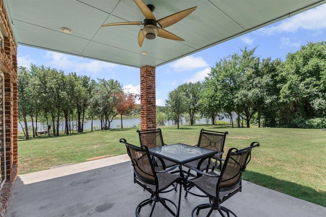 2001 Oak View Ct, Cross Roads, TX 76227 - view of patio / terrace with a water view, ceiling fan, outdoor dining area, and view of wooded area