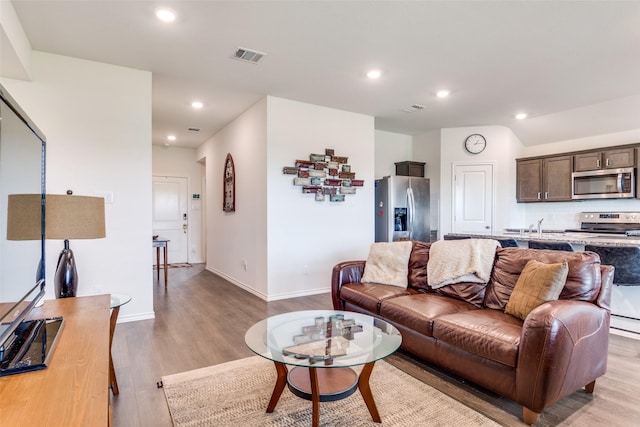 4319 Pyramid Dr, Forney, TX 75126 - living room featuring light wood-style flooring and recessed lighting
