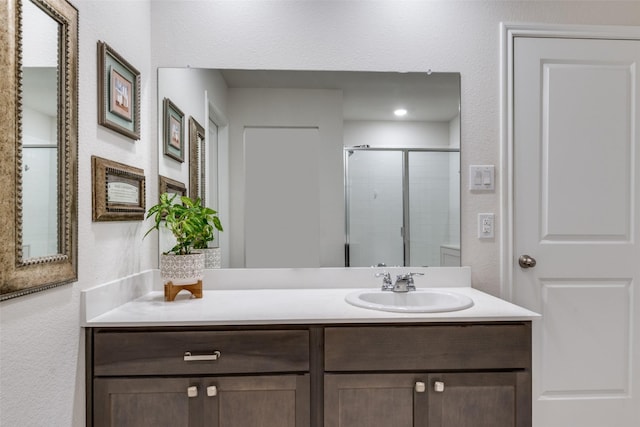 4319 Pyramid Dr, Forney, TX 75126 - bathroom with vanity, a stall shower, and a textured wall