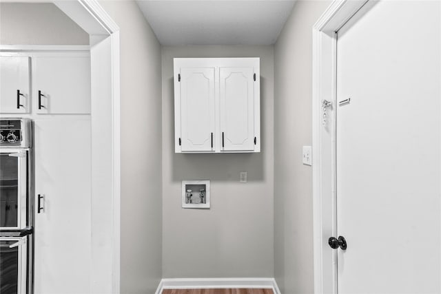 9709 Monticello Dr, Shreveport, LA 71118 - washroom featuring hookup for a washing machine and wood finished floors
