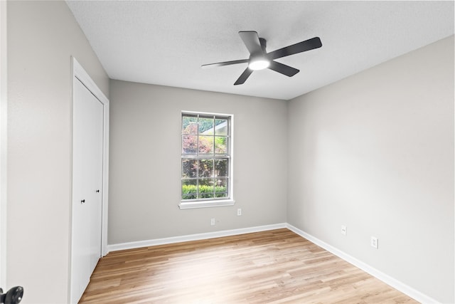 9709 Monticello Dr, Shreveport, LA 71118 - unfurnished bedroom with light wood-type flooring, a closet, a ceiling fan, and a textured ceiling