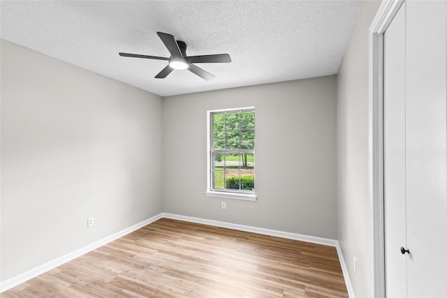 9709 Monticello Dr, Shreveport, LA 71118 - unfurnished room with light wood finished floors, ceiling fan, and a textured ceiling