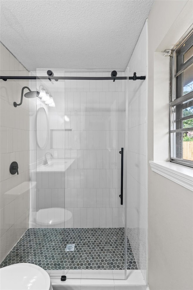 9709 Monticello Dr, Shreveport, LA 71118 - bathroom with a textured ceiling and a stall shower