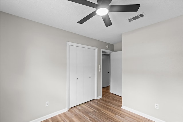 9709 Monticello Dr, Shreveport, LA 71118 - unfurnished bedroom featuring wood finished floors, a closet, and a ceiling fan